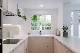 white kitchen with bespoke plywood