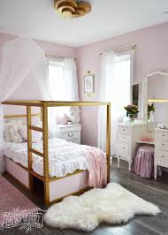 Two cushions in the shape of pink stars bring a romantic touch to the room. A Pink White Gold Shabby Chic Glam Girls Bedroom Reveal Little C S Room Makeover For The Orc The Diy Mommy