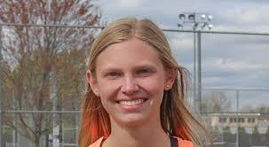 Not my best picture, our team leader Sam Placette serving for singles  against UH's singles opponent.