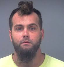 Driver charged in passenger's death