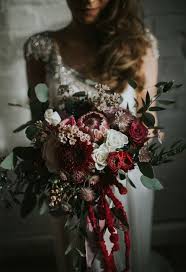 All varieties have been preserved to ensure they will not wilt in the same way living plants would. Deep Red Roses Pink Proteas Gand Greenery Eucalyptus Wedding Bouquet Ideas For Winter Deer Pearl Flowers