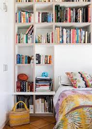 The sunken mattress is surrounded by hidden storage units: 17 Diy Bookcase Headboard Design Ideas