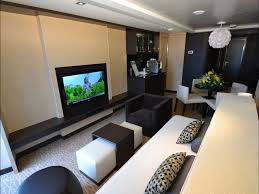 The Living Room Of A Haven Penthouse Has A Double Sofa Bed Writing Desk And Dining Area Penthouse Suites Traveling By Yourself
