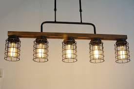 Bicycle rim chandeliers three custom bicycle rim chandelier with crystals above a restaurant bar.restaurant: Rustic Kitchen Island Lighting Metal Cage Linear Chandelier 5 Light Edison E26 069 Baiwaiz Wood Pool Table Light Island Lights Ceiling Lights Rayvoltbike Com