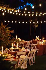 Check out more wedding ideas here. Real Weddings Candice Mike S Diy Wedding In Florida Diy Wedding Lighting Wedding Reception Chairs Backyard Wedding Lighting