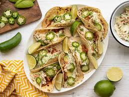 Top with your red cabbage slaw, garlic cilantro fish sauce and your favorite taco toppings! Straightforward Fish Tacos With Cumin Lime Slaw 10q