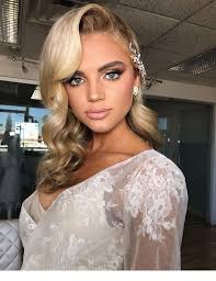 Curly hair with bangs looks extremely cute and feminine. Nice Blonde Curly Hair Glam Style