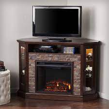Crafted from manufactured wood for guaranteed longevity, this corner stand houses a maximum 50 screen size or a 250lb weight, and heats up 400sq feet room. Southern Enterprises Redden Corner Electric Fireplace Tv Stand Fe9392