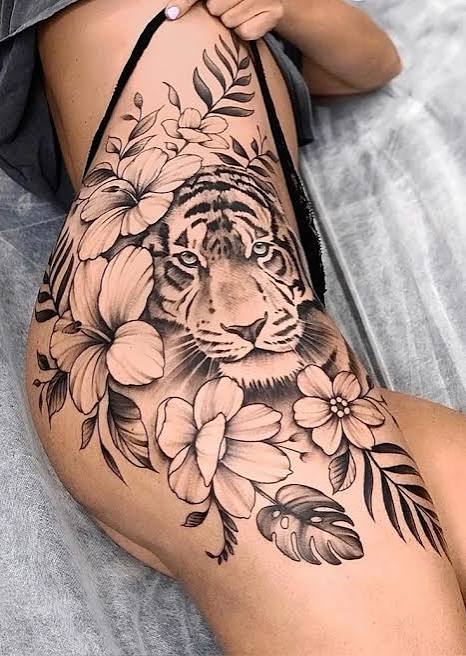 Animal print tiger stripe thigh stretch mark tattoo