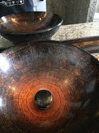 water film off a glass vessel bowl sink