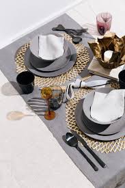 These 100% cotton placemats come in a variety of colors and help protect your table from scratches and spills. Black And Metallic Table Setting Ideas Domino Dinner Table Setting Table Setting Decor Dining Room Table Decor