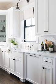 Kitchen cabinets with white countertop black handles and tile backsplash. Black Cabinet Hardware Kitchen Cabinet Hardware Source On Home Bunch Kitchen Cabinethardware New Kitchen Cabinets Kitchen Design Oak Kitchen Cabinets