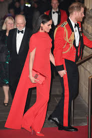 Meghan Markle Stuns In Red With Prince Harry In His Military Finest For Music Festival Ahead Of Royal Exit Meghan Markle Style Prince Harry Military Royal Dresses