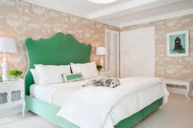 In a bedroom with white walls and ceiling, bold bedding. 22 Green Bedroom Design Ideas For A Fresh Upgrade