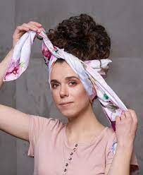 Place a neck strip or a wrap strip at the back of your head, then pull it forward and tie it in front of your forehead. How To Sleep With Curly Hair For Healthy And Defined Locks
