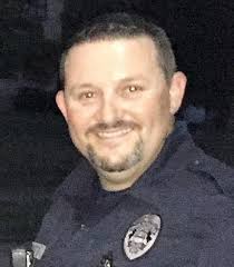 Officer saves man who drove into river