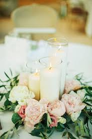 See more ideas about wedding centerpieces, wedding decorations, wedding flowers. Beautiful Wedding Centerpiece Made Of Candles In Cylinder Vases And Pastel P Flower Centerpieces Wedding Summer Wedding Centerpieces Cheap Wedding Centerpieces