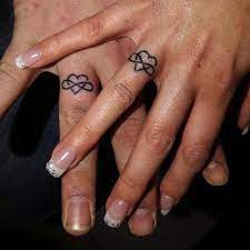 Wedding Ring Tattoos Inked Magazine Wedding Band Tattoo Tattoo Wedding Rings Ring Finger Tattoos