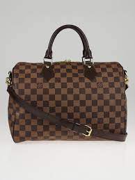 The iconic monogram canvas gets a little twist again for this season. Louis Vuitton Damier Canvas Speedy 30 Bandouliere Bag Yoogi S Closet