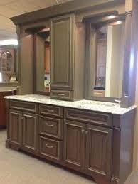 Its contemporary lines are enhanced by the wood finish. Double Vanity With Linen Tower Middle Google Search Grey Stained Cabinets Traditional Bathroom Vanity Bathroom