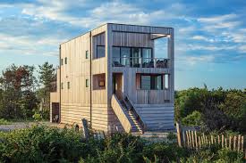 We offer new england colonial blueprints, farmhouses, small cottage floor plans, craftsman home designs & more. This Beach House In Charlestown Offers A Modern Take On Coastal Architecture