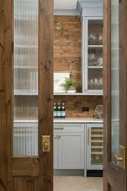 Now you're ready to eliminate the flimsy railing hardware that is distressed old and replace it with the new roller track hardware. Blue Pantry Cabinets With Wood Plank Backsplash Transitional Kitchen