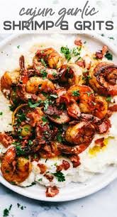 Cajun Garlic Shrimp And Grits Are The Perfect Savory Dish That You Will Want On Your Table Best Part Is It S Easy Recipes Cajun Shrimp And Grits Cajun Dishes