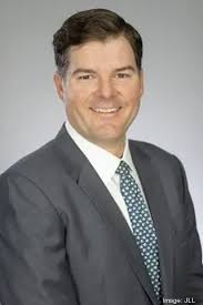 JLL hires Tyler Garrett from Transwestern to lead office agency leasing  team