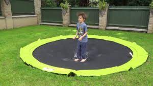 In addition, the american academy of orthopaedic surgeons recommends that the trampoline jumping surface be placed at ground level to reduce the number of injuries and injury severity. Plum In Ground Sunken Trampoline Youtube