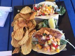 The fish—we use cod, but any flaky variety works—marinates in a mixture of lime juice, chili powder, and cumin that will become your standard. Fish Tacos Picture Of Longboards Tiki Beach Grille Cocoa Beach Tripadvisor