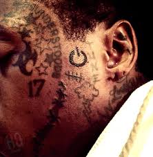 This video brings to you lil wayne tattoos and their meanings. Lil Wayne Tattoos The Power Symbol On His Face