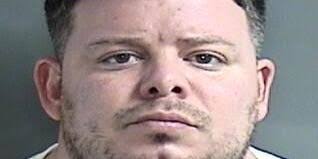 Police: Woman attacked, seized at high-rise, resident charged