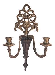 Antique, well crafted, mirrored wall sconce featuring a curved reflective background and a shiny metal candle holder at the bottom. Ornate Brass Wall Sconce Candle Taper Victorian Candle Holders Wall Candle Holders Victorian Candles