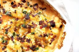 This loaded cauliflower, made with butter, sour cream, chives, cheddar cheese and bacon, is the ultimate in low carb comfort food! Loaded Cauliflower Casserole Recipe Perfect Keto