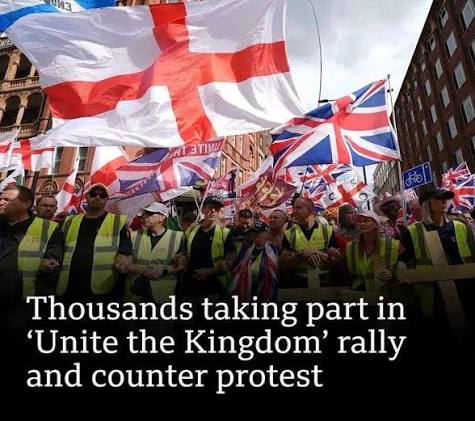 Aerial footage broadcast by UK media showed tens of thousands at far-right  activist Tommy Robinson's rally - a sea of British Union Jack, English St  George's and other flags - while an