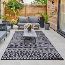 These visually aesthetic brands cover boring flooring and breathe new life into your garden themes and décor. Jazz Grey Indoor Outdoor Rug In 2 Sizes Costco Uk