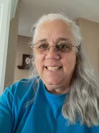 Mouse stealing coffee from man at work