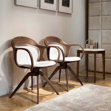 Standing on solid beech legs, interestingly angled, the padded and fully upholstered. Norah Chairs And Small Armchairs Giorgetti