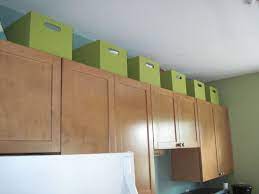 Displaying your tea service is a good to wrap up ultimately, the answer for how to decorate above kitchen cabinets is simple. Use The Space Above Kitchen Cabinets For Extra Storage In A Small Space Storage Bins Reduce Vis Kitchen Cabinet Storage Kitchen Cabinets Under Cabinet Storage