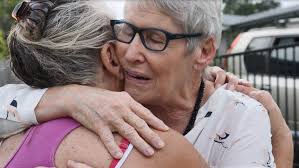 Retired nurse denied COVID-19 travel exemption to care for dying sister  reunited with her at last