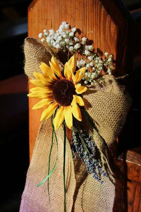 Sunflower pew ends wedding. We could totally do this.