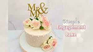 The white tiers are then decorated with white icing that is piped on the edges. Simple Engagement Cake Youtube