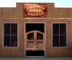 The saloon was often depicted having duel wooden doors that swung open, a wide wooden boardwalk in front and a step. Saloon Doors Custom Saloon Doors Saloon Door Hinge Hardware Old Western Saloon Doors Saloon Doors Custom Wood Doors Western Saloon Old West Saloon
