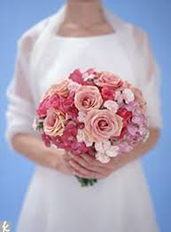 A tussy mussy bouquet is simply a nosegay style bouquet carried in a small vase made from metal, porcelain or any other material that works with your wedding scheme. Bridal Bouquet Photos