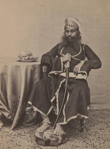 Circa early 1860's. India, Delhi. 'Rajpoots.' 'The group photograph shows a party of Chohan soldiers armed in the native manner. The figure on the right has a broad shield at his back,