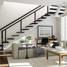 6 Creative Ways To Decorate The Awkward Corners In Your Home Stairs In Living Room Living Room Under Stairs Living Room Design Modern