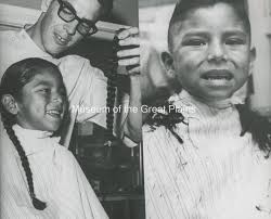 Patrick Alfred Tsotigh, son of Rev. Sherwood Tsotigh, getting his first  hair cut at age six. August 1967. Delbert Bland, barber. Date 1967