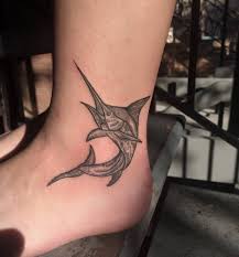 Whether you're a fisherman or seeker of the ethereal depths, there's something uniquely timeless about the marlin. Swordfish Tattoo On The Ankle
