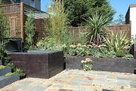 We are passionate about railway sleepers. Raised Railway Sleeper Water Feature And Beds Modern Garten London Von Earth Designs Garden And Build London And Essex