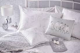 Crafted from cotton, each piece in this set is dotted with the embroidered pattern of a red pickup truck hauling a christmas tree on a beige background. Christmas Bedding Our Pick Of The Best Festive Bedding Sets Loveproperty Com